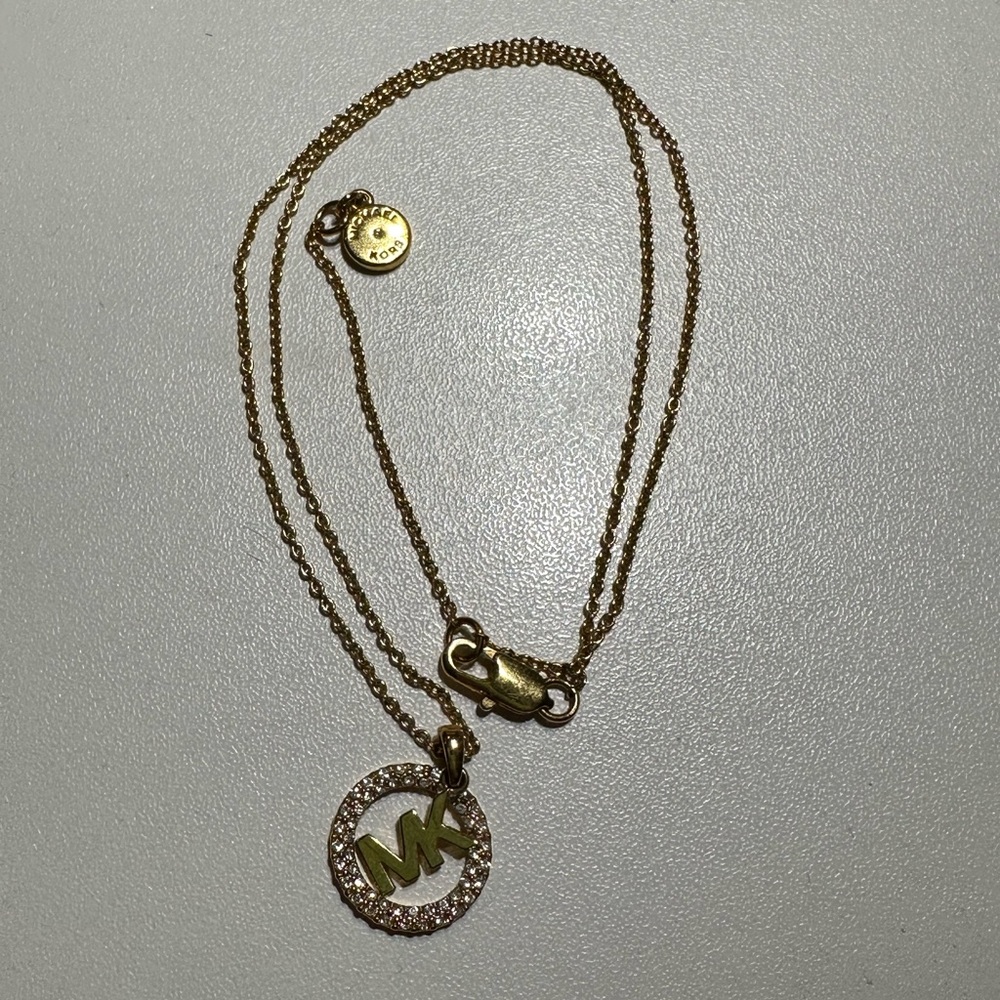 Gold Michael Kors necklace and bracelet with rhinestones
